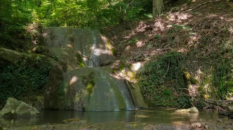 Small waterfall in forest Stock Footage 67559602