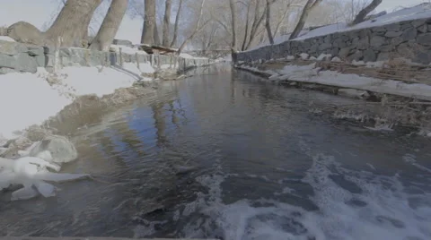 Small waterfall in forest in park Stock Footage 60421672