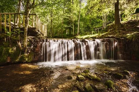 Small waterfall in the forest Stock Photos