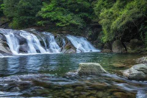Small waterfall in the forest Stock Photos