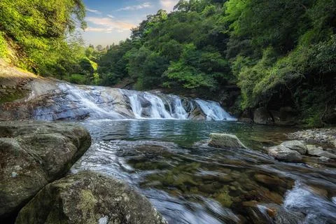 Small waterfall in the forest Stock Photos