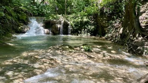 Small waterfall in the forest Stock Photos