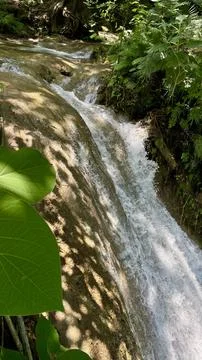 Small waterfall in the forest Stock Photos