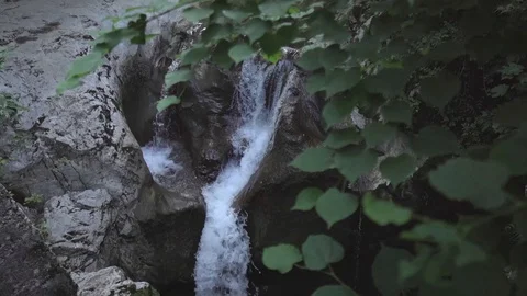 Small waterfall in the forest, slow motion Stock Footage 129767311
