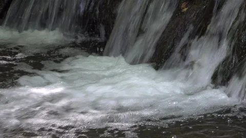 Small waterfall on a forest stream Video stock 332723733