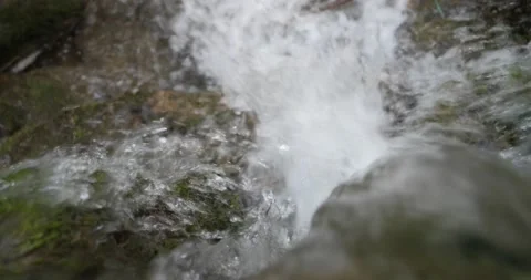 Small waterfall in a forest, top view, close up slider shot Stock Footage 157551395