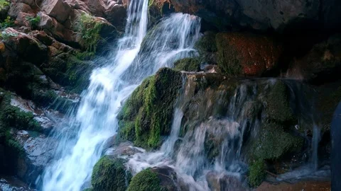 A small waterfall in front of the Kulasya waterfall in the Tashkent region Stock Footage 171559341