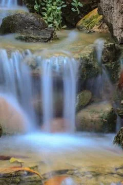 Small waterfall in a garden Stock Photos