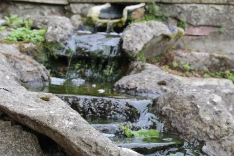 Small waterfall in a garden Stock Photos