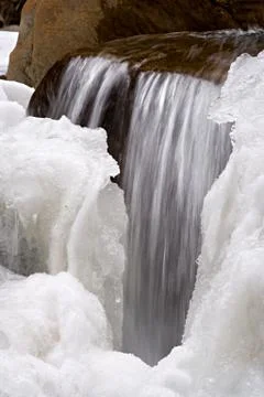 A small waterfall with ice in Austria. Stock Photos