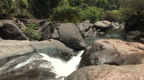 Small waterfall in the jungle in India Stock Footage 2880088