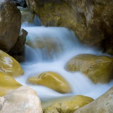 Small waterfall on mountain brook Stock Photos