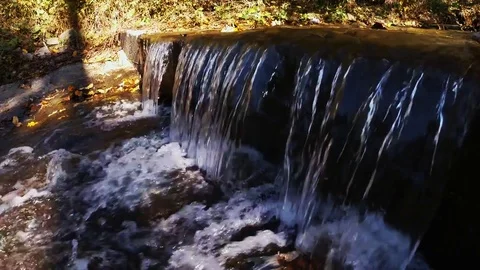 Small waterfall on mountain creek Stock Footage 81252701