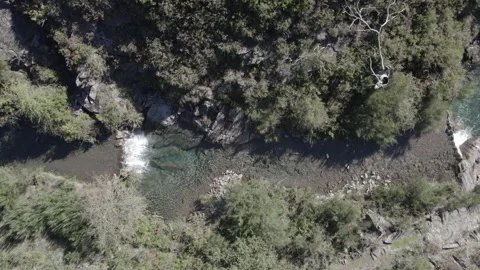 Small waterfall in a mountain creek Stock Footage 237339876