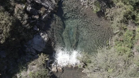 Small waterfall in a mountain creek Stock Footage 237339967