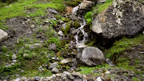 A small waterfall in mountain Stock Footage 245896582