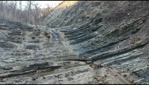 Small waterfall in a mountain gorge Stock Footage 149321563