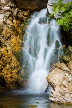 Small waterfall on mountain river Stock Photos