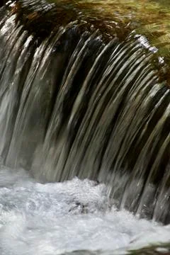 Small waterfall in a mountain river Stock Photos