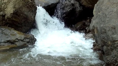 Small waterfall on the mountain river on rahtawu, java island Stock-Footage 123948809