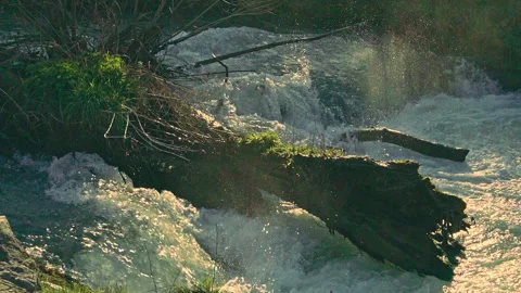 Small waterfall of a mountain river. Slow Motion Stock Footage 149840648