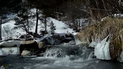 Small waterfall mountain river in the winter weather. Stock Footage 73123448
