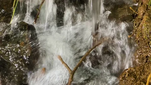 Small waterfall in a mountain stream Stock Footage 159570909