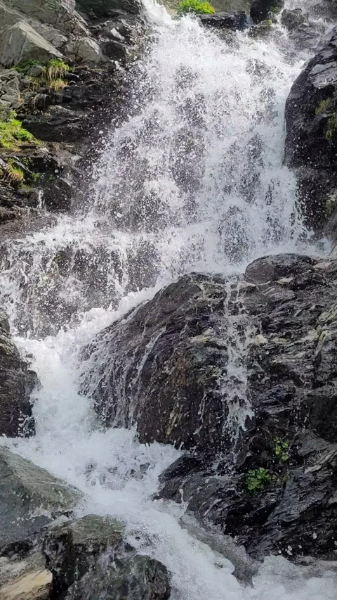 Small waterfall on a mountain stream Stock Footage 278008617