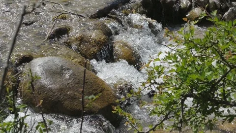 A small waterfall in a mountain stream slow motion. Stock Footage 91047896