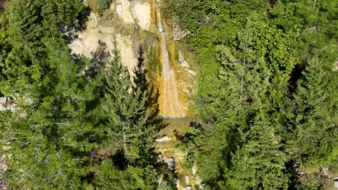 A small waterfall in the mountains aerial view 4 K Stock Footage 226497934
