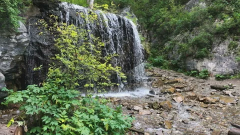 A small waterfall in mountains Stock Footage 93027983