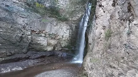 A small waterfall in the mountains Stock Footage 311910512