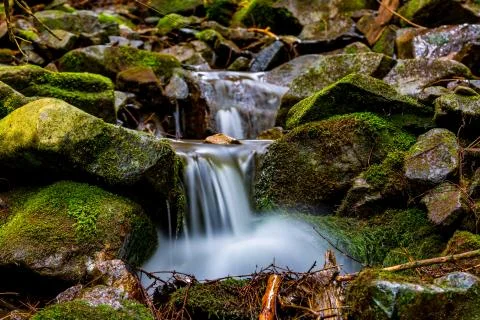 Small waterfall in mountains Stock Photos