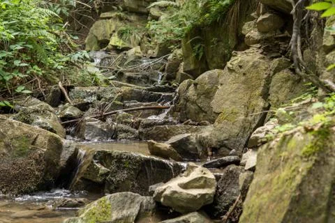 Small waterfall in mountains Stock Photos