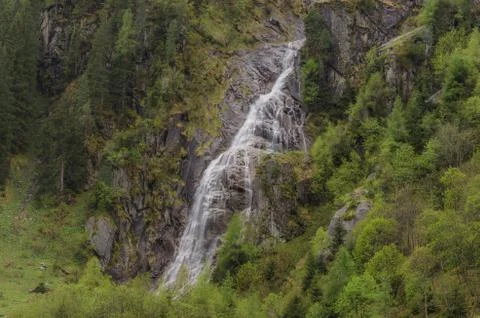 Small waterfall mountains trees Stock Photos