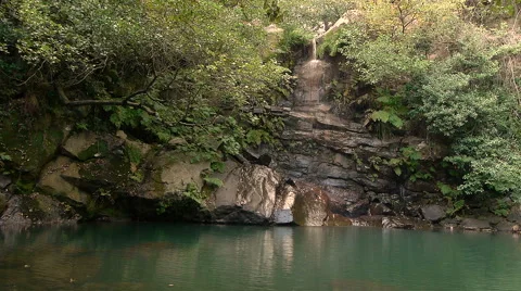 Small waterfall with a natural pool Stock Footage 43240692