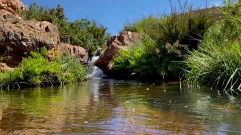 Small waterfall into natural pool at Maalgat in the Cederberg, South Africa Stock Footage 181495175