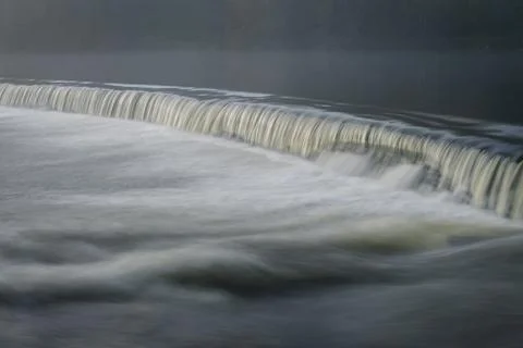 Small waterfall in an old dam Stock Photos