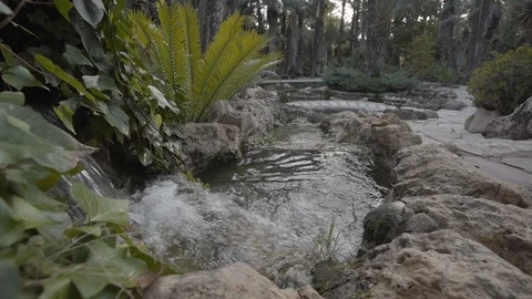 Small waterfall in the park in slow motion Stockbeeldmateriaal 98357005