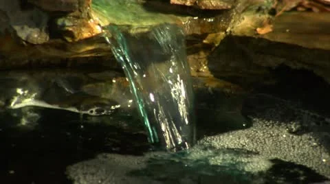 Small Waterfall into Pond - CU (1080-24FPS).mp4 Stock Footage 10976323