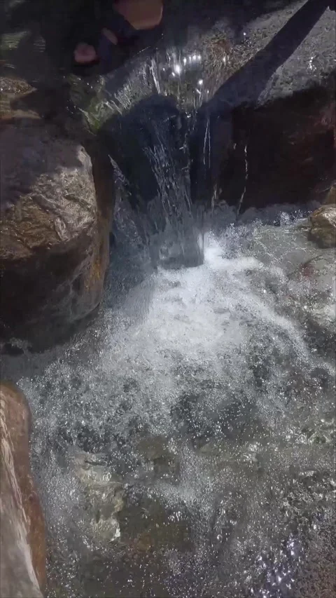 Small Waterfall Pouring into a Rock Basin at Ras El Maa in Chefchaouen Morocco 스톡 동영상 340554983