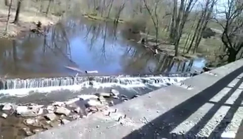 Small waterfall in the river hellertown pennsylvania Stock Footage 183861371