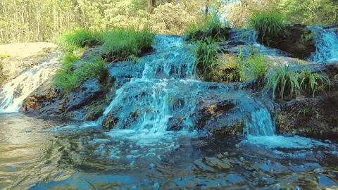 Small waterfall from the river in the mountains. Fresh water. Summer travel Stock-Footage 155306165