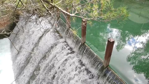 Small waterfall on the river in parkland Stock-Footage 164651965