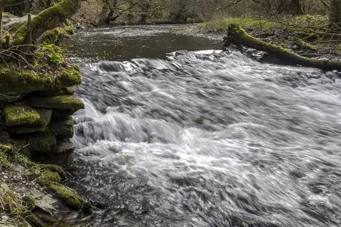 A small waterfall on a river Stock Photos