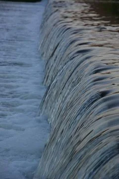 Small waterfall in a river Stock Photos