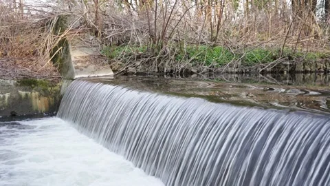 A small waterfall in the river on a spring day Stock Footage 194798401