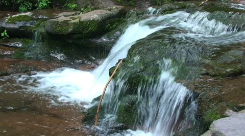 Small Waterfall in River with Stick Stock Footage 481922