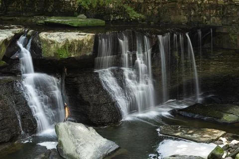 Small waterfall on the rocks in a forest Stock-Fotos