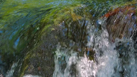 Small waterfall with rocks in the water Stock-Footage 88481484